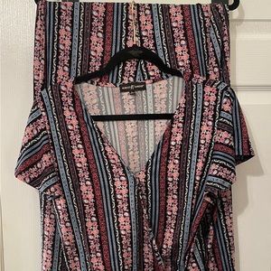 Two piece pink and black pant set.